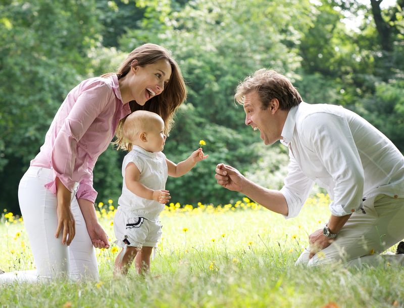 happy-family-toddler-walking-dreamstime_s_32549821